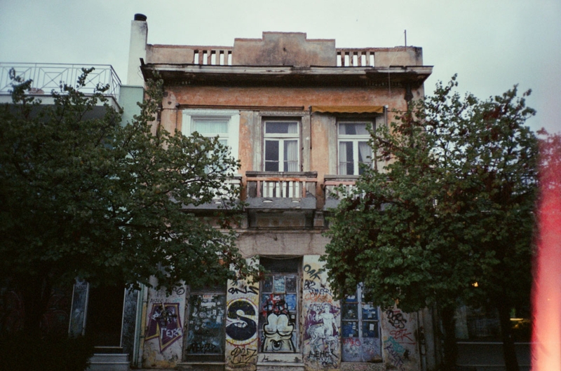 Athens house's main door full of graffiti